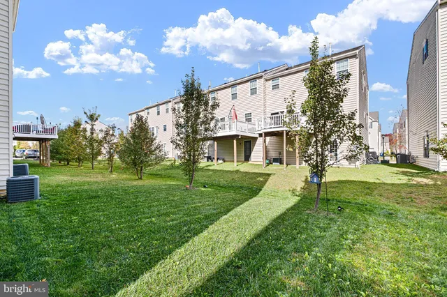 a view of a house with a big yard
