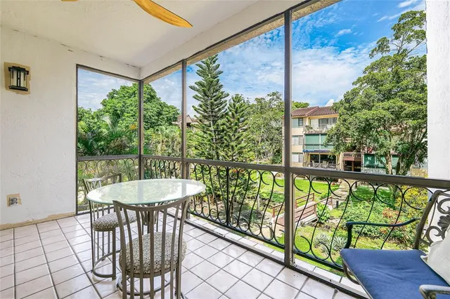 a view of a balcony with furniture