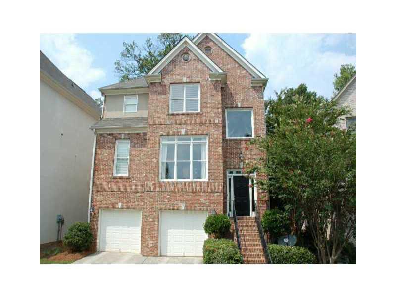 Exterior Front. Brick Home in small gated cul de sac community with front landscaping maintained by the association.