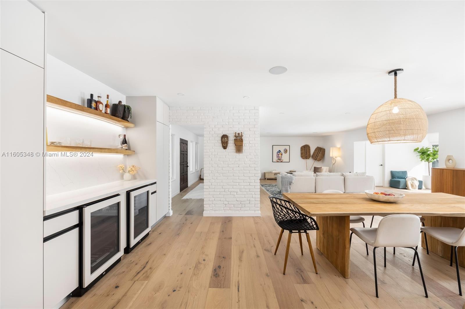 9800 Southwest 70th Avenue Pinecrest, FL 33156 - Photo 15 of 46 a view of a dining room with furniture and wooden floor