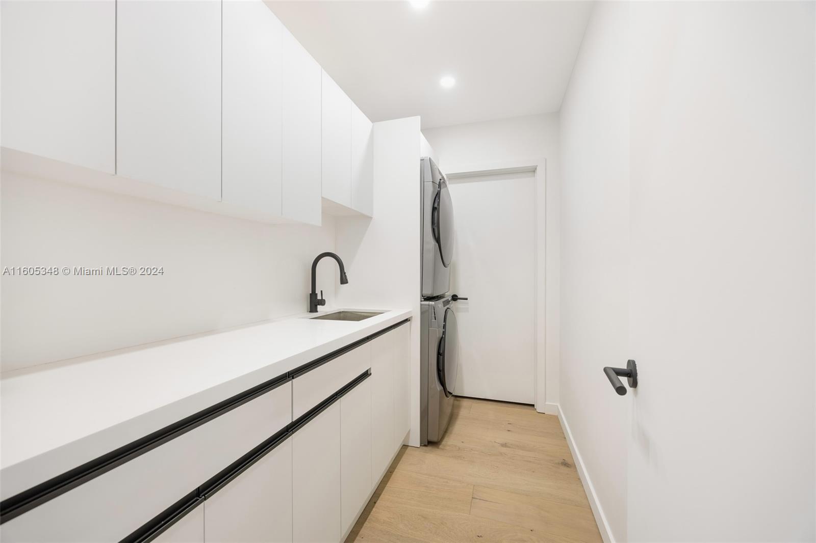 9800 Southwest 70th Avenue Pinecrest, FL 33156 - Photo 16 of 46 a view of a bathroom with sink and mirror
