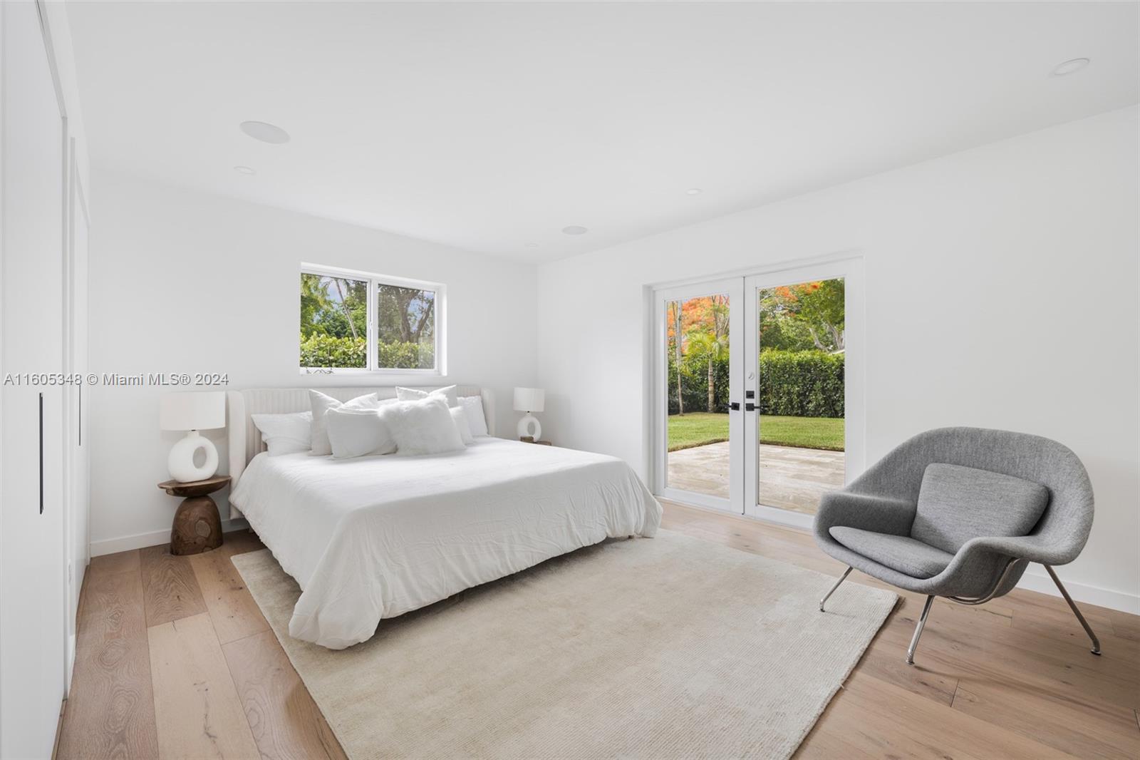 9800 Southwest 70th Avenue Pinecrest, FL 33156 - Photo 19 of 46 a bedroom with a bed and a window