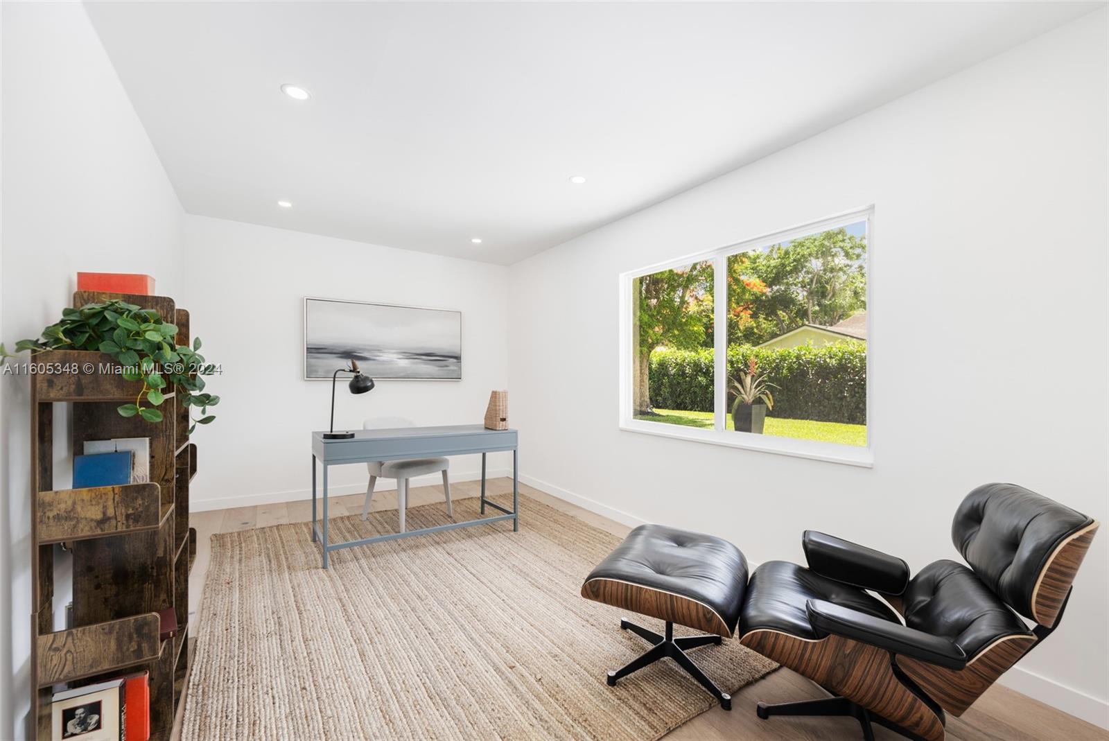9800 Southwest 70th Avenue Pinecrest, FL 33156 - Photo 23 of 46 a living room with furniture and a wooden floor