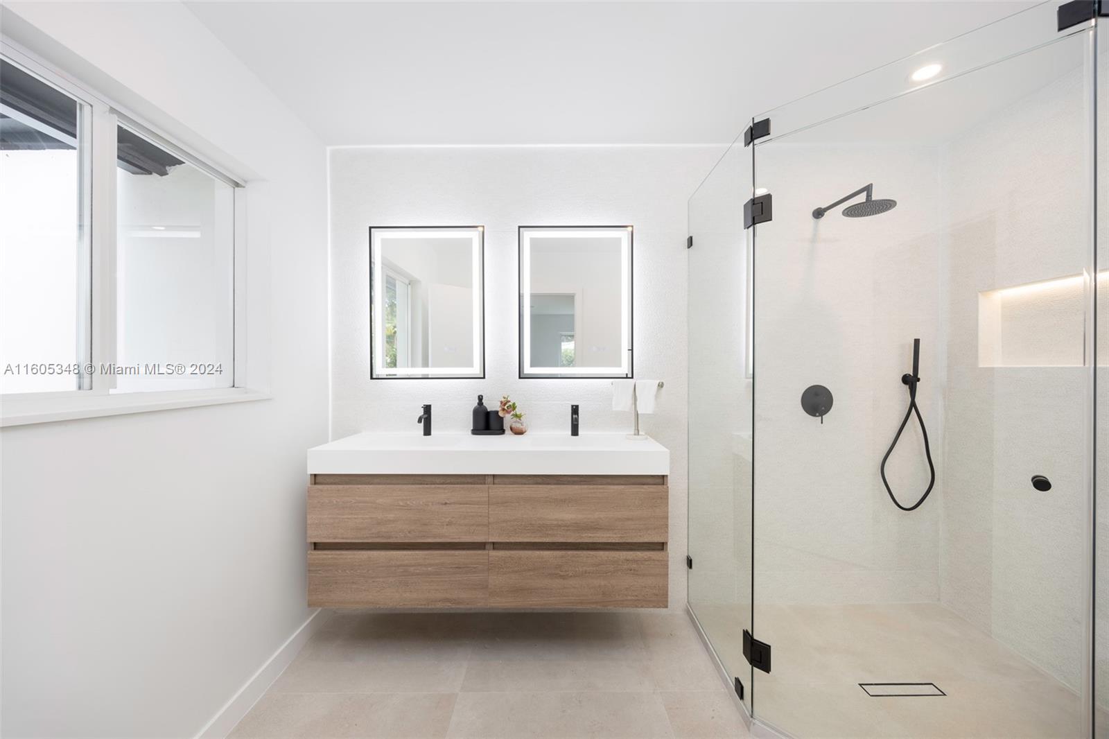 9800 Southwest 70th Avenue Pinecrest, FL 33156 - Photo 24 of 46 a bathroom with a bathtub a shower and a sink