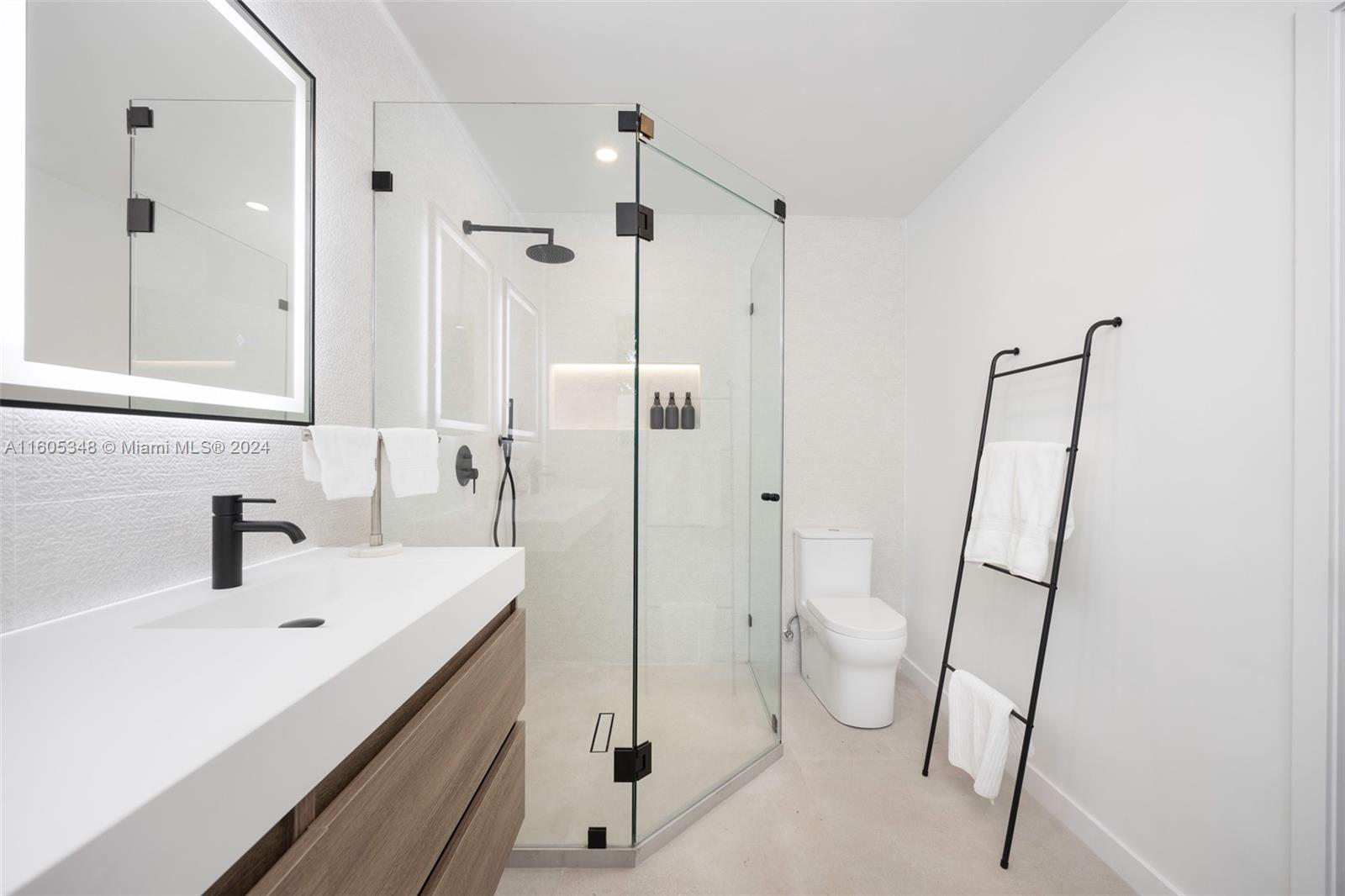 9800 Southwest 70th Avenue Pinecrest, FL 33156 - Photo 25 of 46 a bathroom with a sink a toilet and a shower