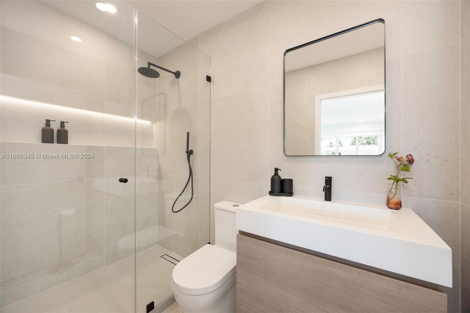 9800 Southwest 70th Avenue Pinecrest, FL 33156 - Photo 27 of 46 a bathroom with a sink toilet and shower