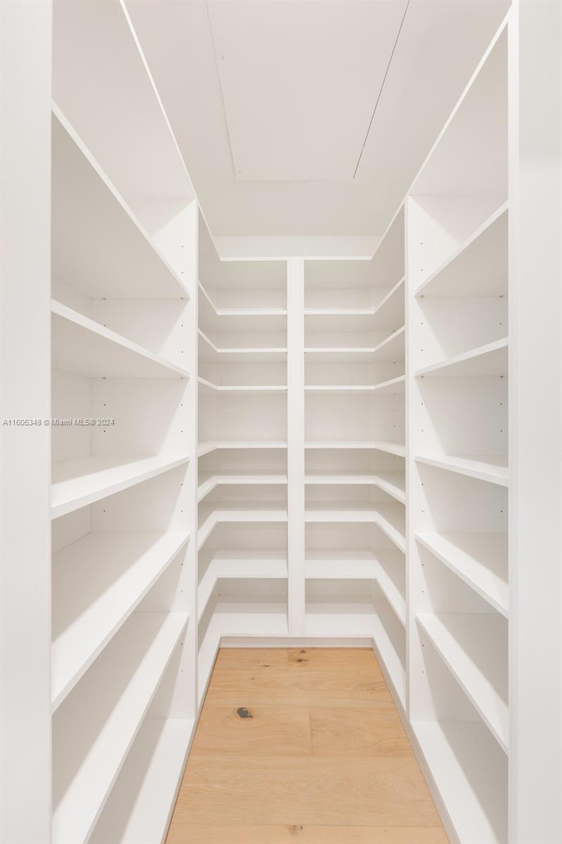 9800 Southwest 70th Avenue Pinecrest, FL 33156 - Photo 29 of 46 a view of an empty walk in closet