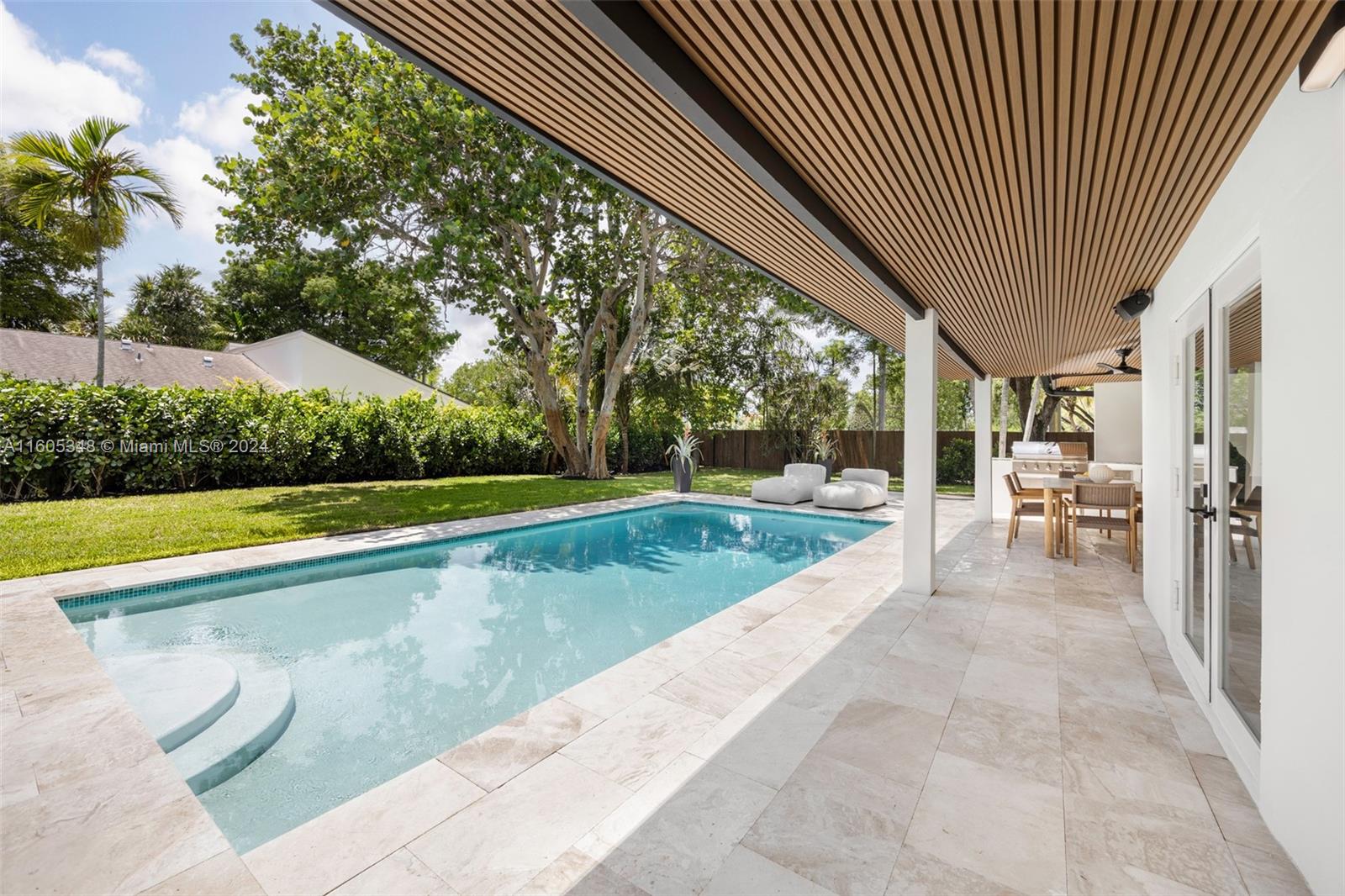 9800 Southwest 70th Avenue Pinecrest, FL 33156 - Photo 30 of 46 a view of swimming pool with a yard