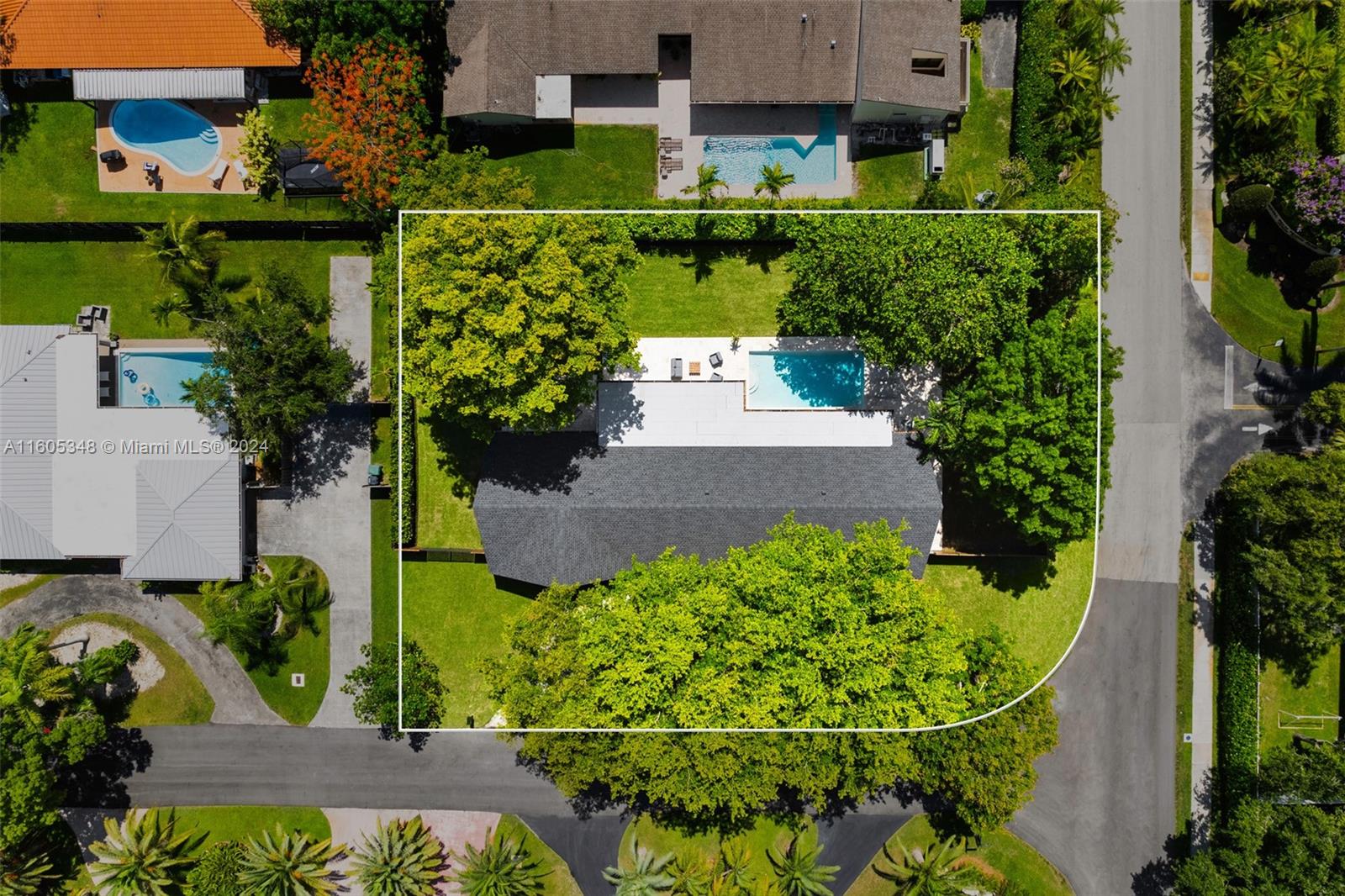 9800 Southwest 70th Avenue Pinecrest, FL 33156 - Photo 38 of 46 an aerial view of a house with a yard