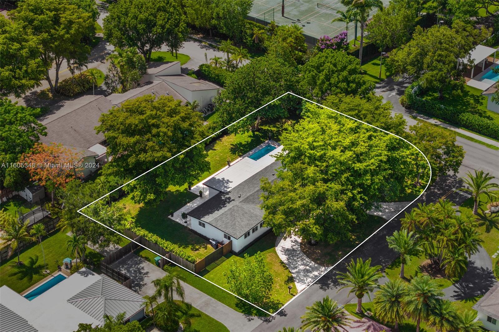 9800 Southwest 70th Avenue Pinecrest, FL 33156 - Photo 40 of 46 an aerial view of a tennis court
