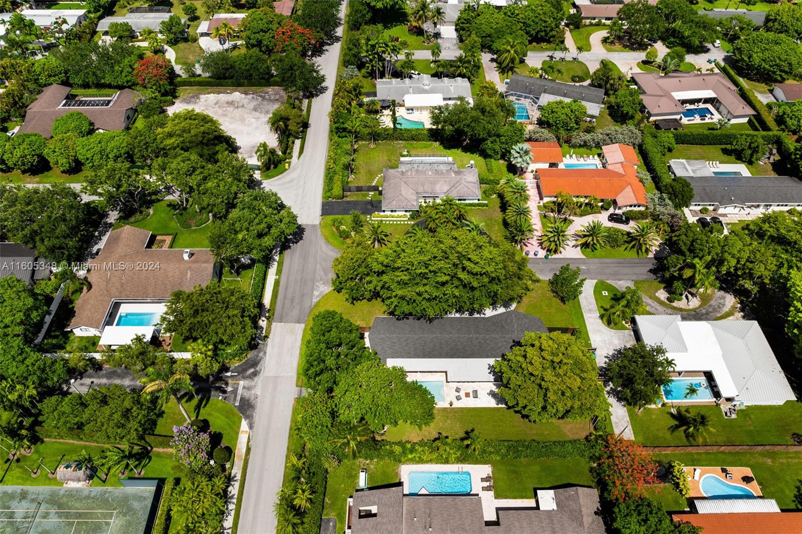 9800 Southwest 70th Avenue Pinecrest, FL 33156 - Photo 41 of 46 an aerial view of residential houses with outdoor space and trees all around