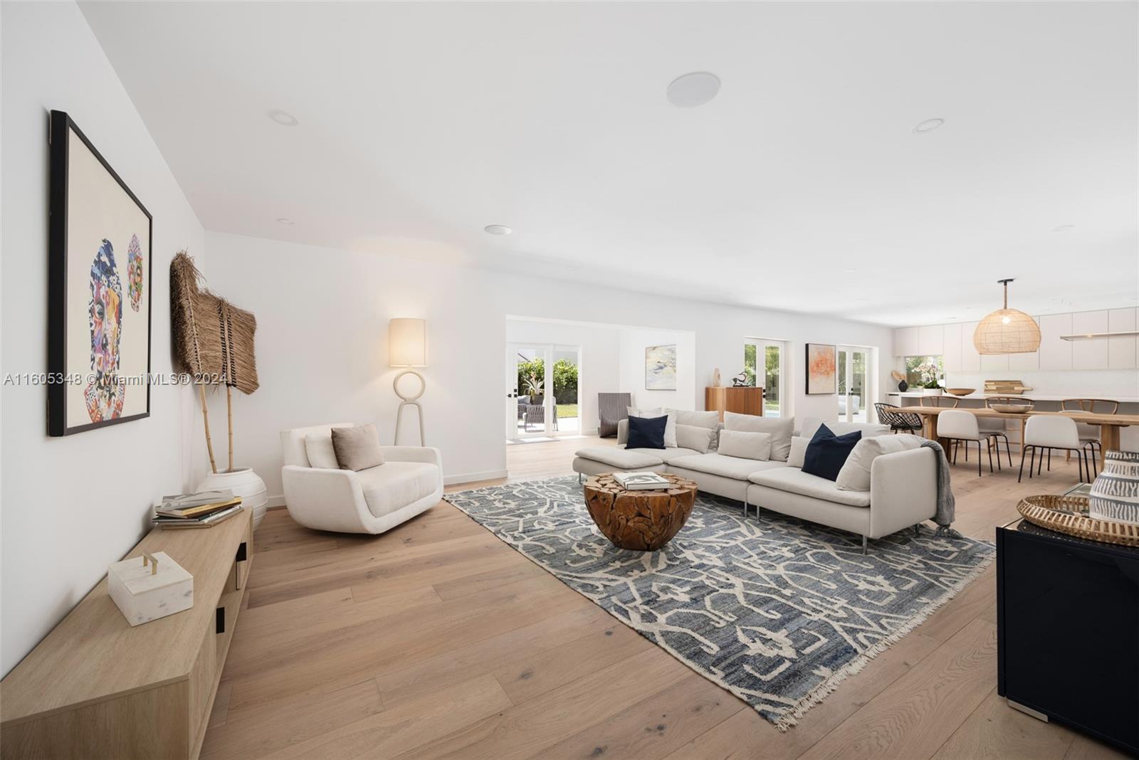 9800 Southwest 70th Avenue Pinecrest, FL 33156 - Photo 5 of 46 a living room with furniture and a lamp