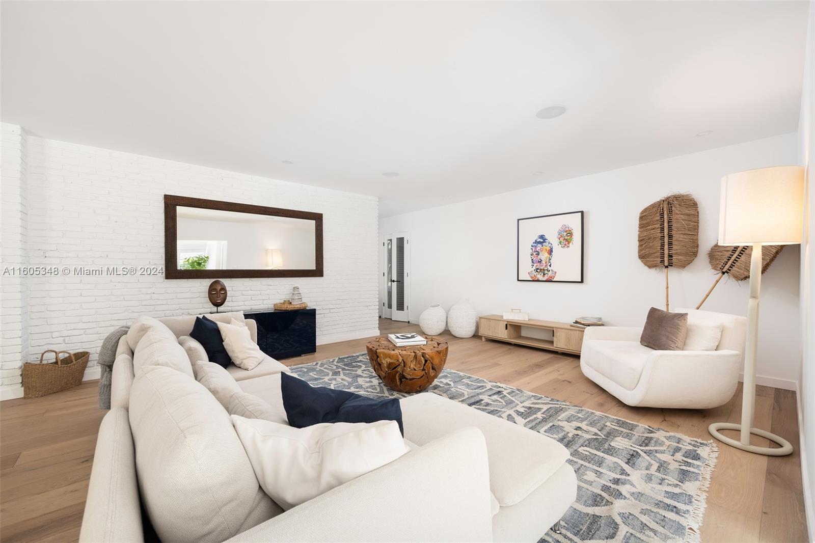 9800 Southwest 70th Avenue Pinecrest, FL 33156 - Photo 7 of 46 a living room with furniture and a flat screen tv