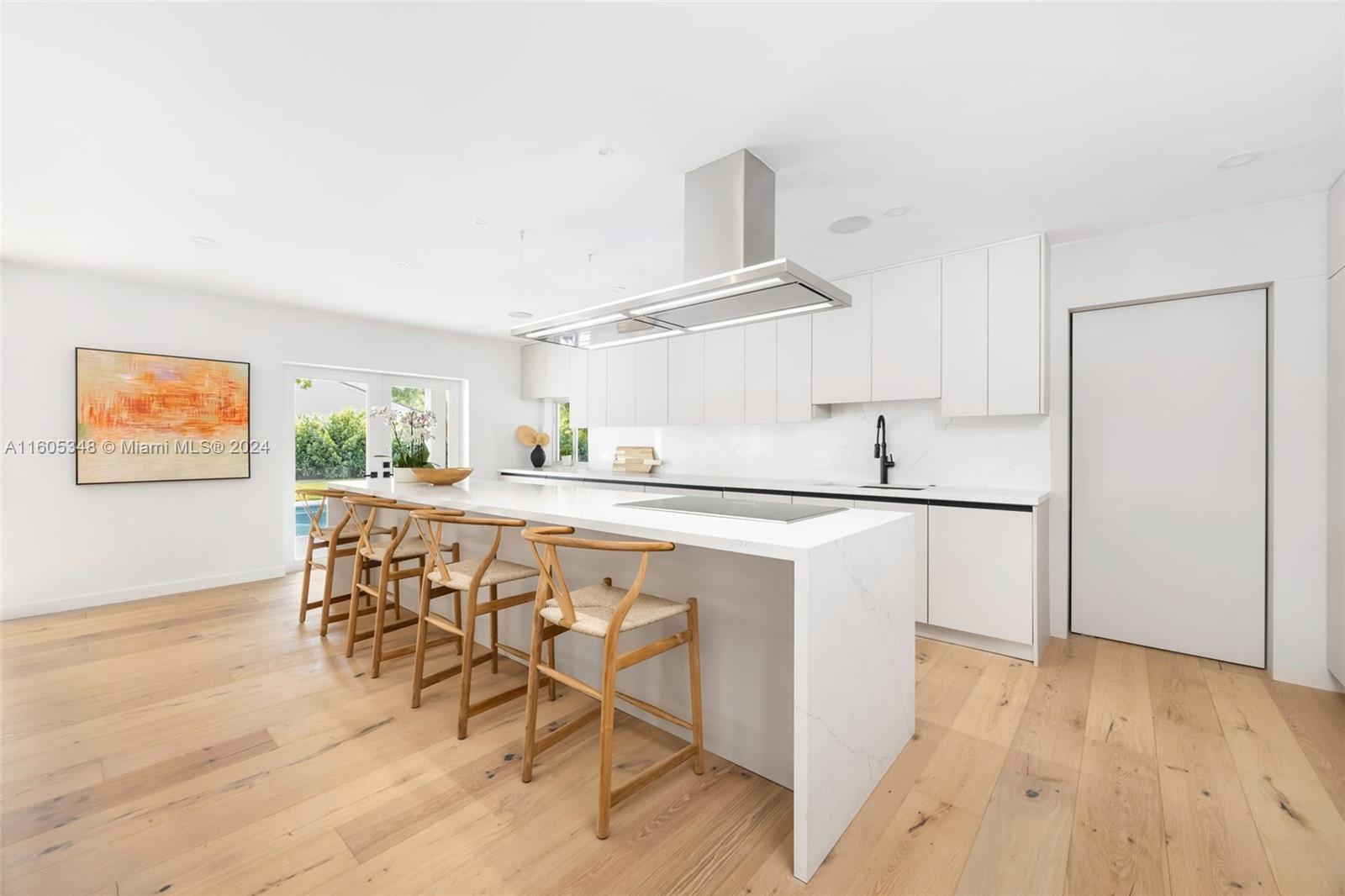 9800 Southwest 70th Avenue Pinecrest, FL 33156 - Photo 9 of 46 a kitchen with stainless steel appliances a refrigerator and a stove top oven