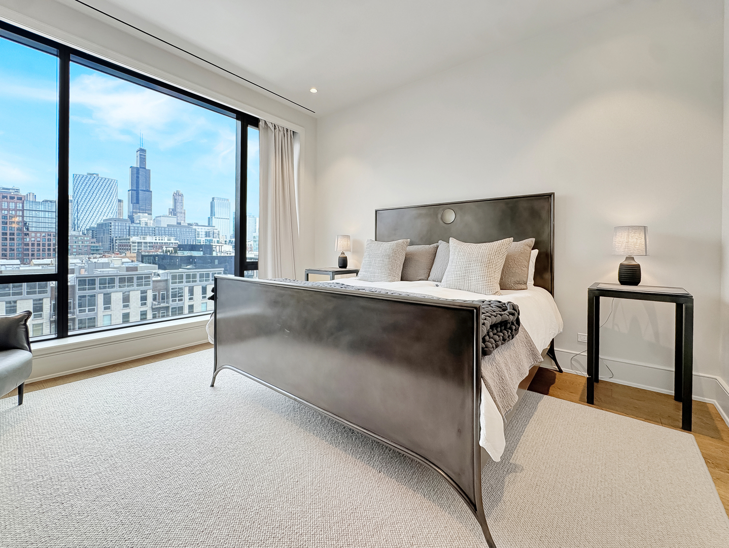 21 North May Street, Unit 802 Chicago, IL 60607 - Photo 20 of 50 a bedroom with a bed and a night stand