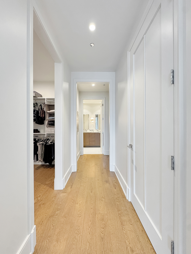 21 North May Street, Unit 802 Chicago, IL 60607 - Photo 22 of 50 a view of a hallway with wooden shelves