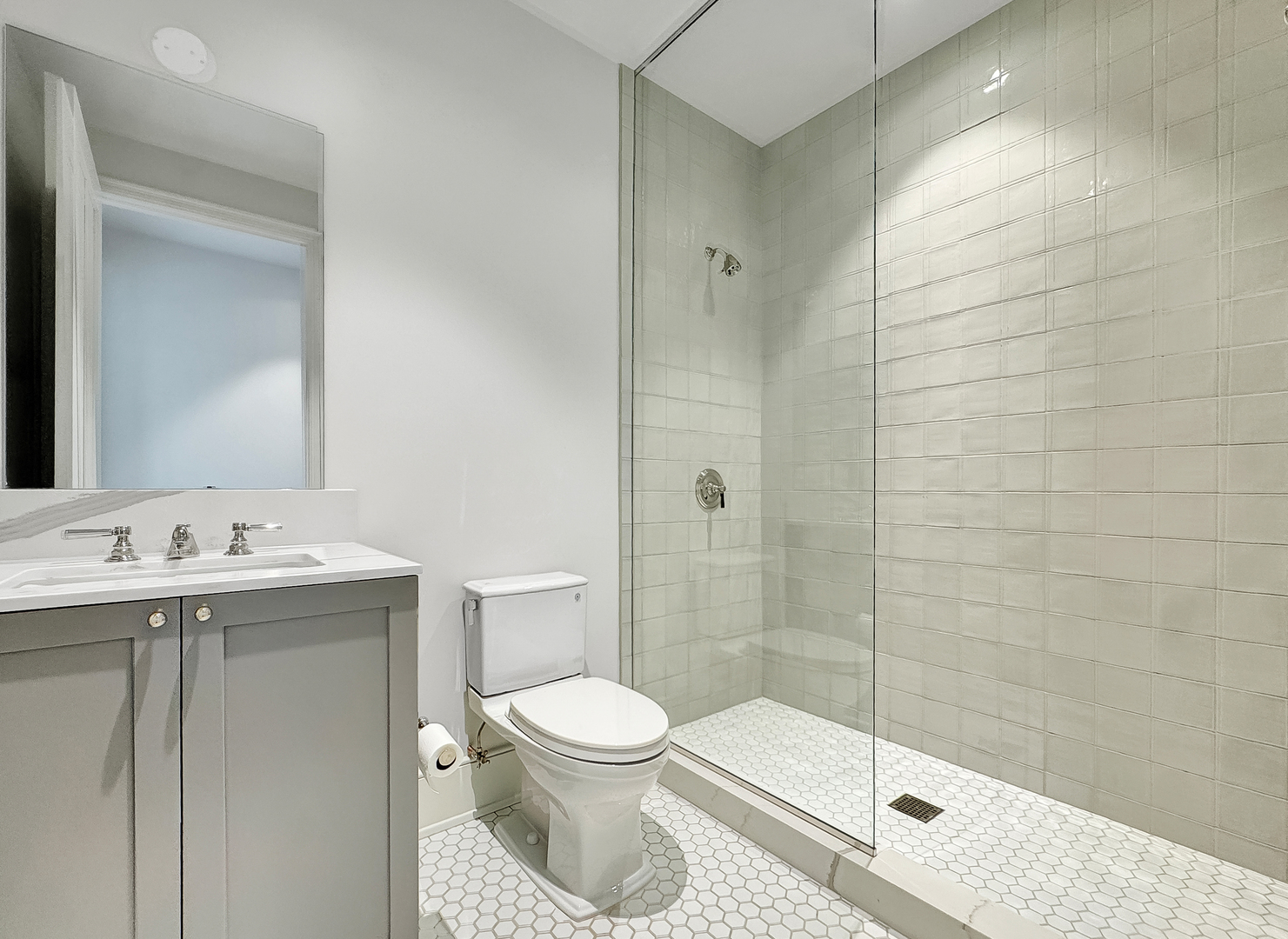 21 North May Street, Unit 802 Chicago, IL 60607 - Photo 29 of 50 a bathroom with a toilet a sink and shower