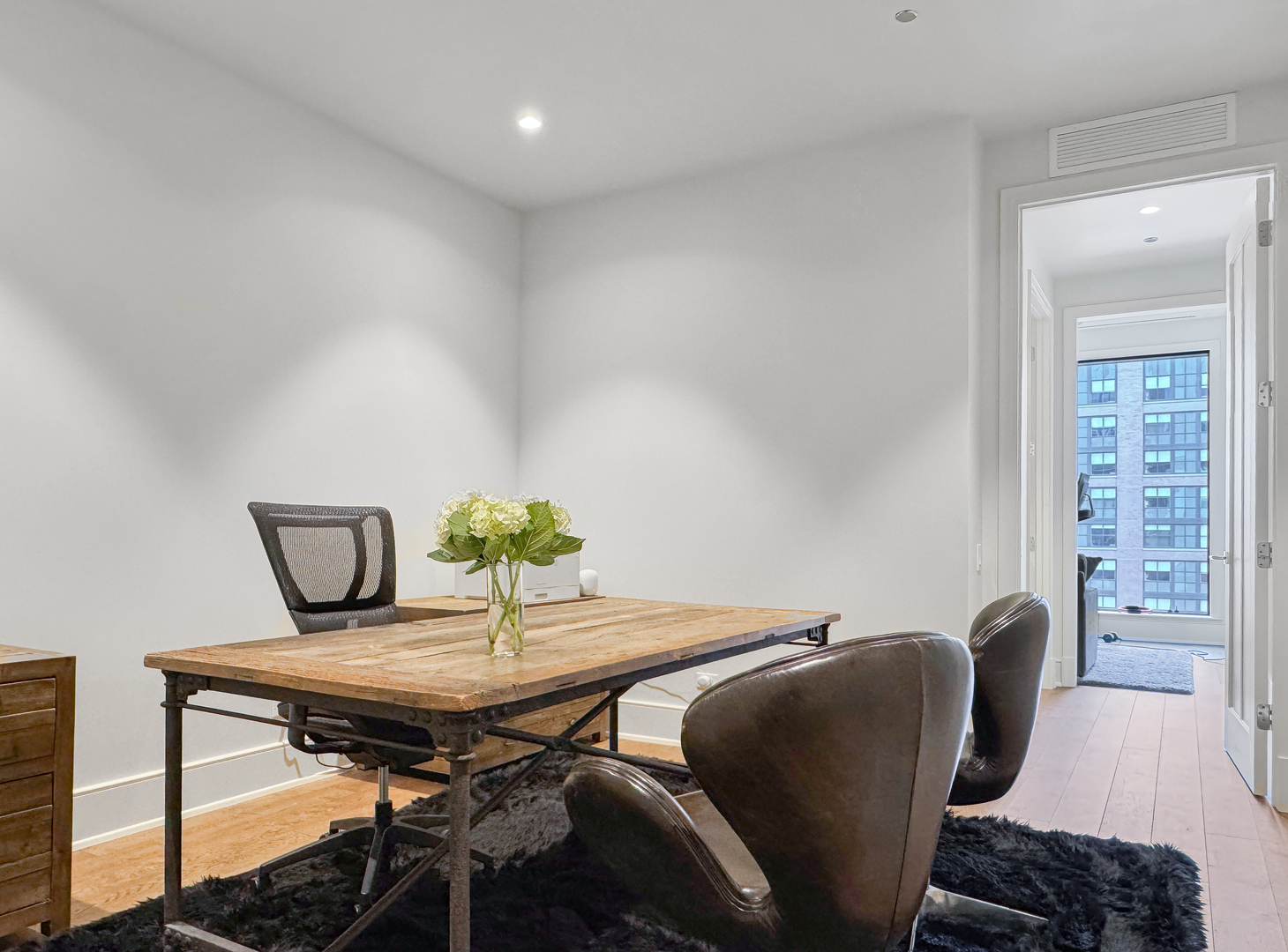 21 North May Street, Unit 802 Chicago, IL 60607 - Photo 33 of 50 a view of a dining room with furniture and wooden floor