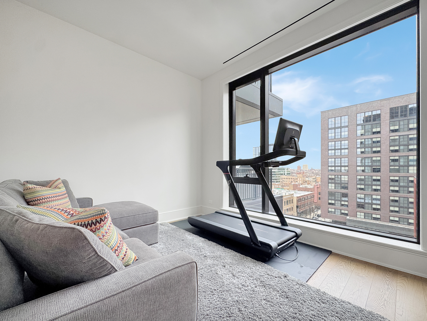 21 North May Street, Unit 802 Chicago, IL 60607 - Photo 34 of 50 a living room with a couch and a window