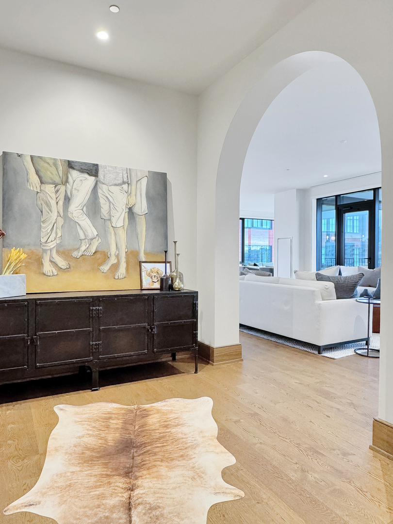 21 North May Street, Unit 802 Chicago, IL 60607 - Photo 4 of 50 a living room with couch and a dresser