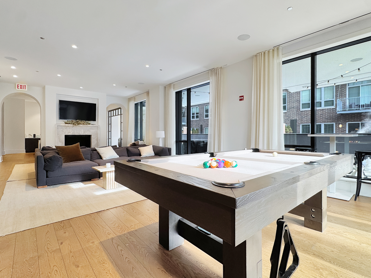 21 North May Street, Unit 802 Chicago, IL 60607 - Photo 45 of 50 a living room with kitchen island furniture and a table