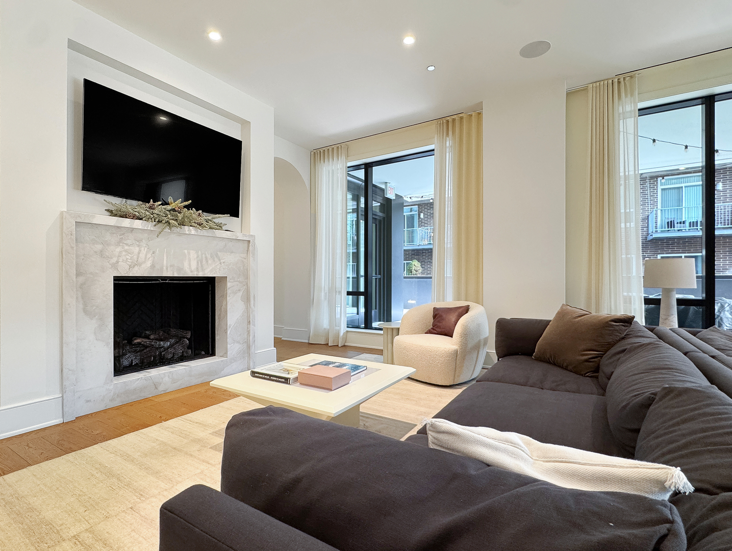 21 North May Street, Unit 802 Chicago, IL 60607 - Photo 46 of 50 a living room with furniture fireplace and flat screen tv