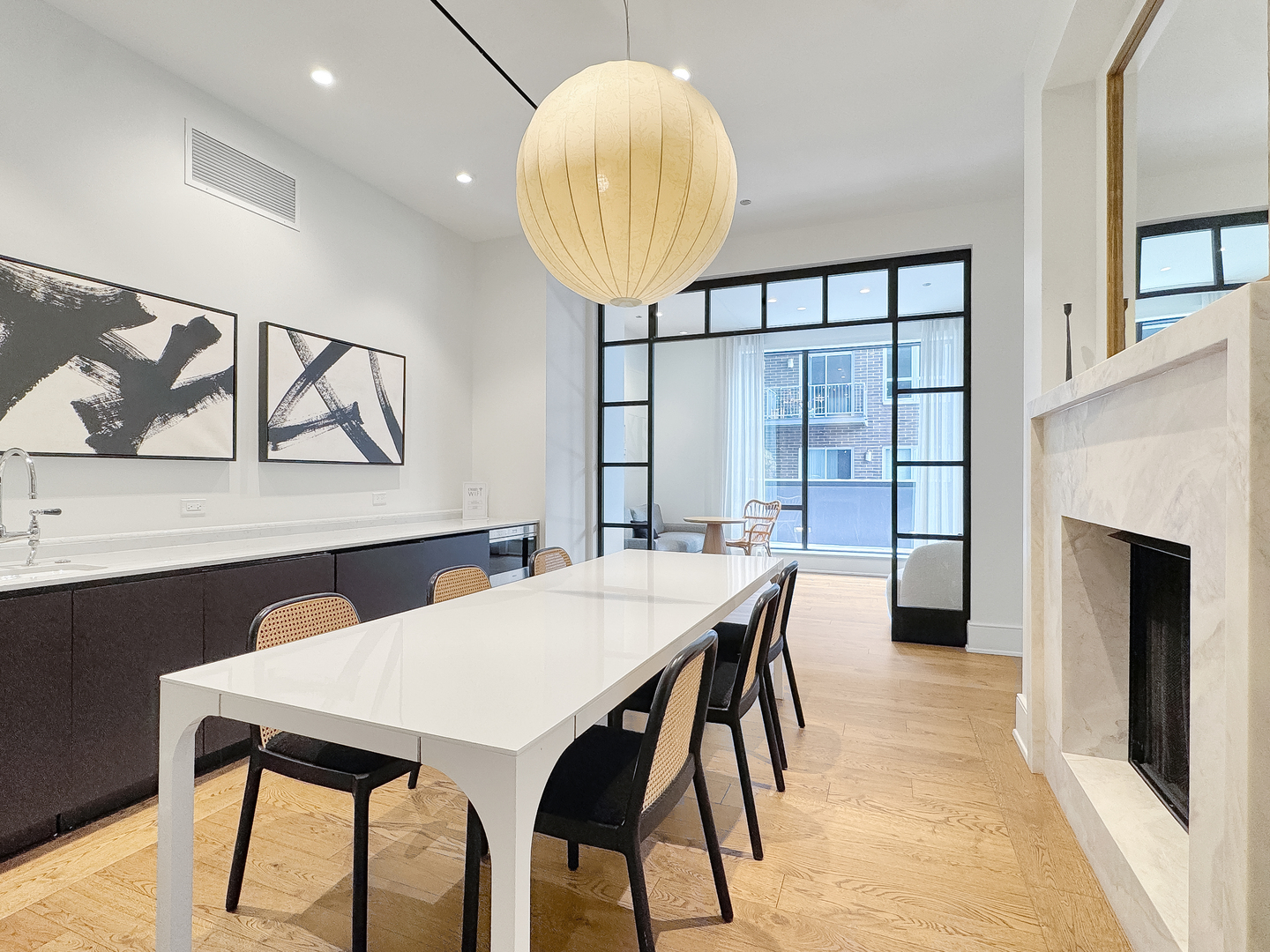 21 North May Street, Unit 802 Chicago, IL 60607 - Photo 47 of 50 a view of a dining room with furniture and a chandelier