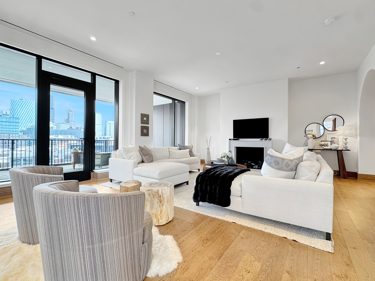 21 North May Street, Unit 802 Chicago, IL 60607 - Photo 7 of 50 a living room with furniture and a flat screen tv