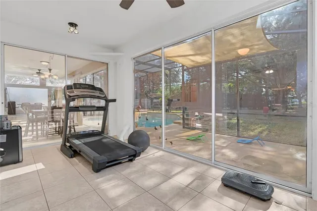 a bed room with a bed and a chair