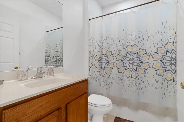 a living room with furniture and large window