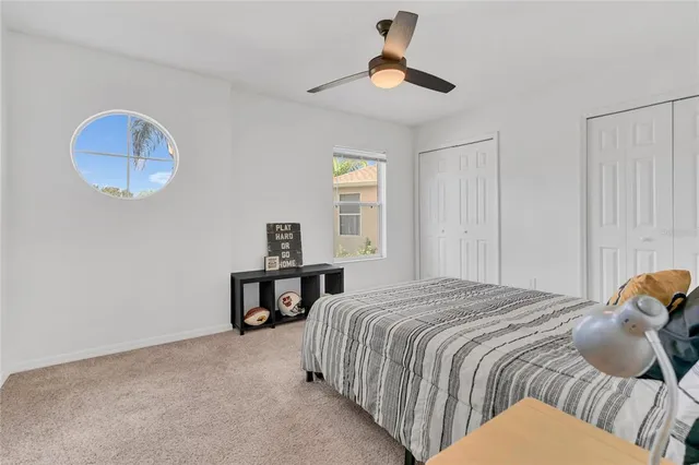 a bathroom with a tub a sink and mirror