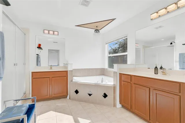 an aerial view of a house with swimming pool and outdoor space