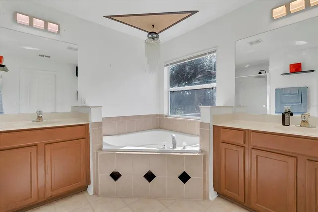 a view of a swimming pool with an outdoor space and seating area