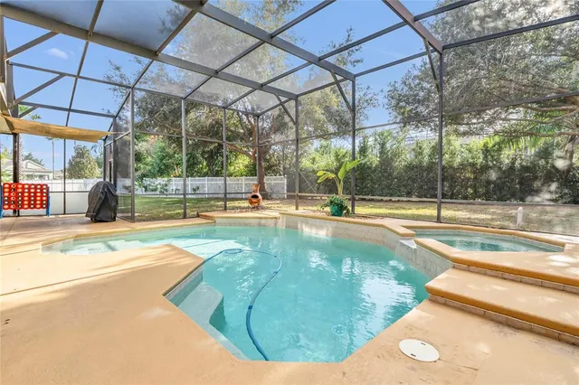 an aerial view of residential houses with outdoor space and river