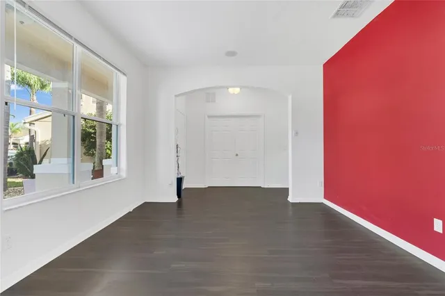 a view of an entryway with wooden floor