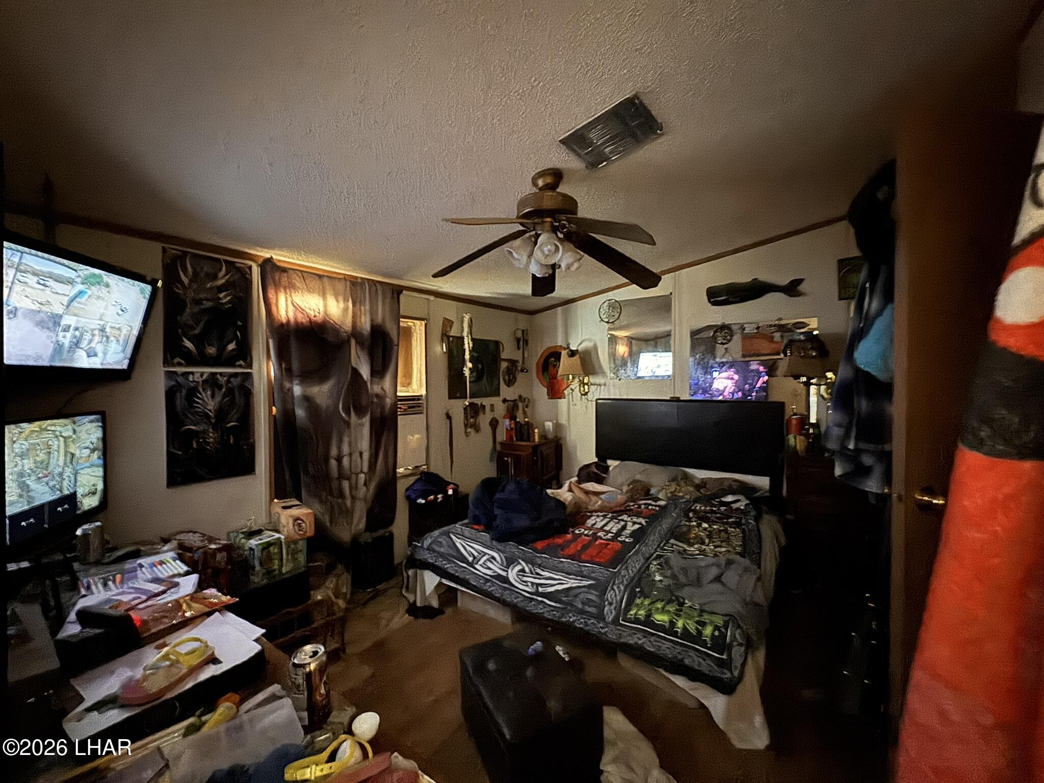 69896 Salome Road Salome, AZ 85348 - Photo 6 of 19 a room with gym equipment and a flat screen tv