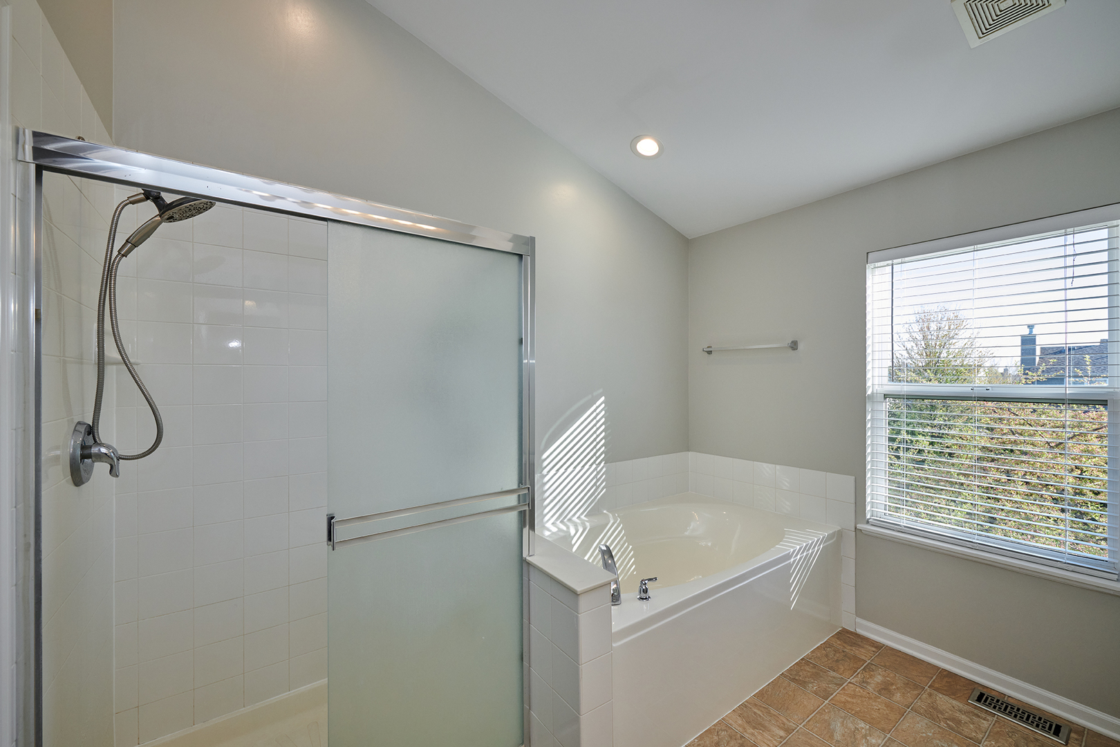 312 Shelbourne Road Volo, IL 60073 - Photo 21 of 54 a bathroom with a bath tub with a shower