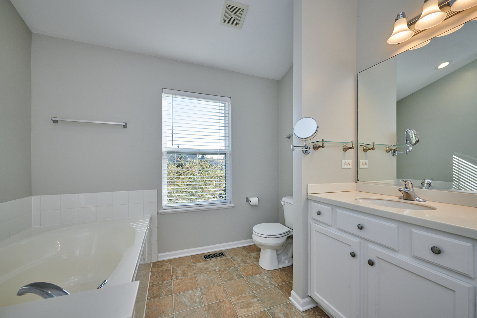312 Shelbourne Road Volo, IL 60073 - Photo 22 of 54 a bathroom with a bathtub shower sink mirror and toilet