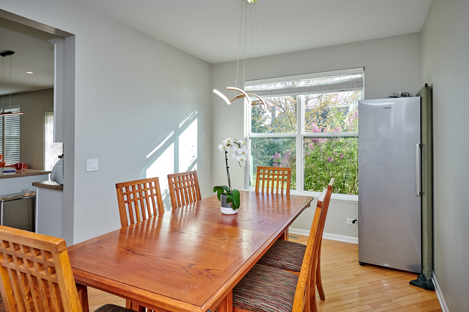 312 Shelbourne Road Volo, IL 60073 - Photo 30 of 54 a view of a dining room with furniture window and wooden floor