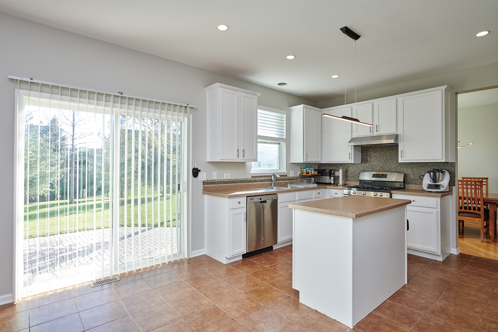 312 Shelbourne Road Volo, IL 60073 - Photo 35 of 54 a kitchen with white cabinets and white appliances