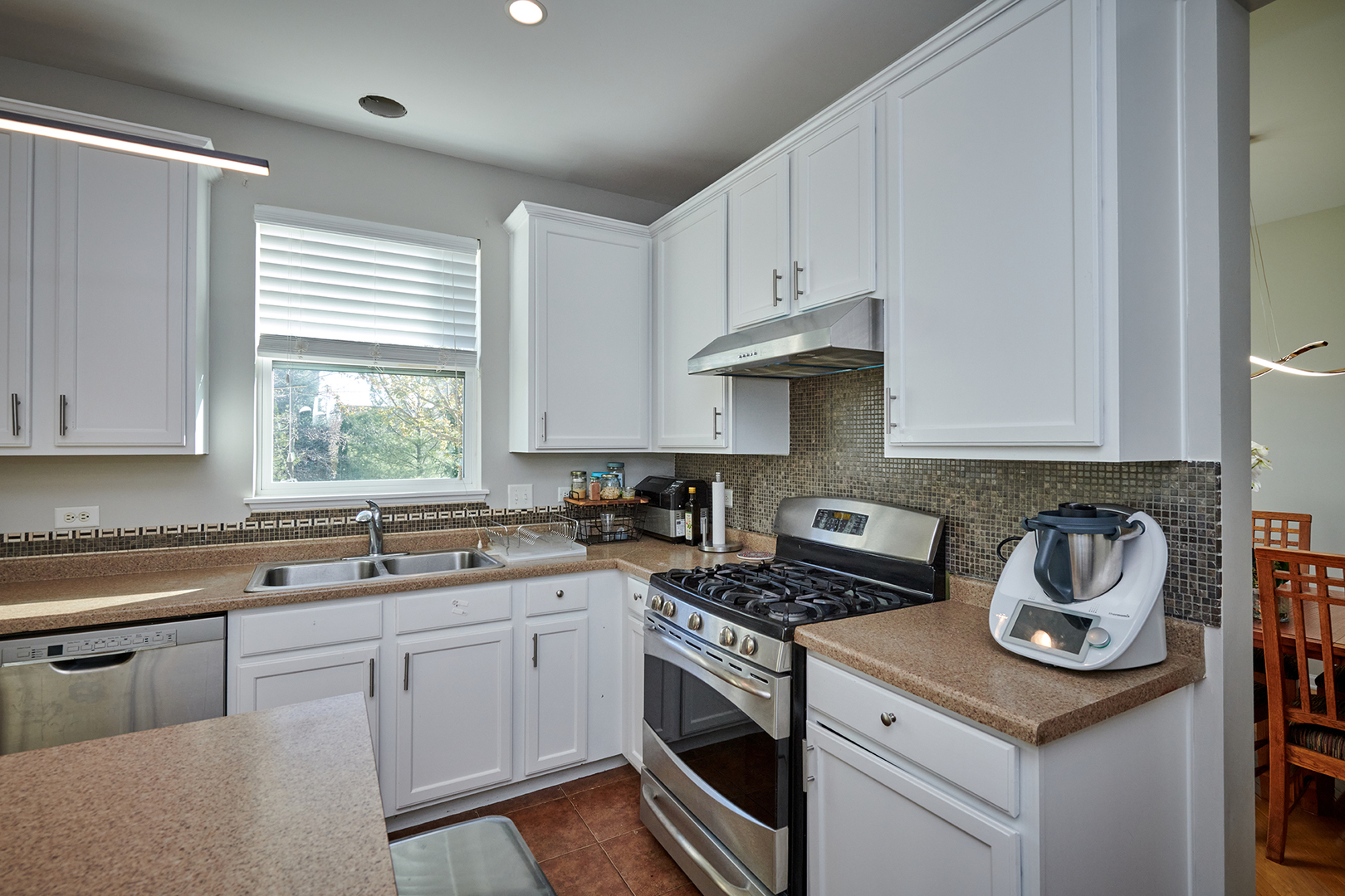 312 Shelbourne Road Volo, IL 60073 - Photo 38 of 54 a kitchen with appliances a sink and cabinets