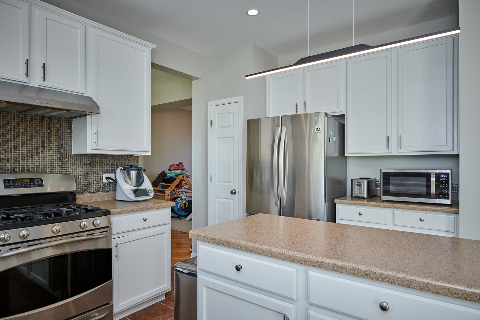 312 Shelbourne Road Volo, IL 60073 - Photo 40 of 54 a kitchen with stainless steel appliances granite countertop a refrigerator sink and stove