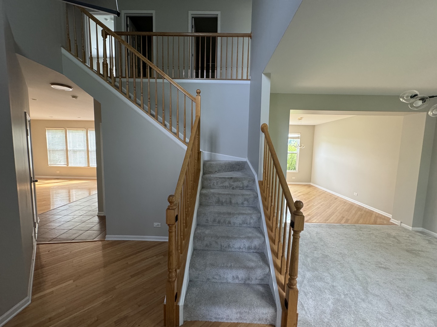 312 Shelbourne Road Volo, IL 60073 - Photo 47 of 54 a view of staircase with wooden floor and a front door