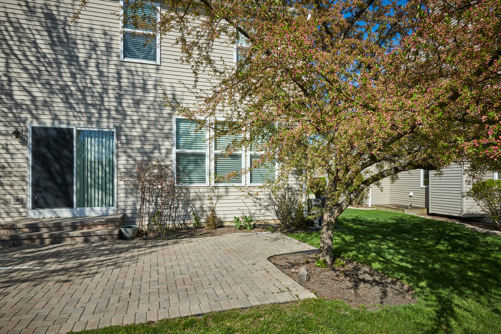 312 Shelbourne Road Volo, IL 60073 - Photo 7 of 54 a view of a brick house with a yard