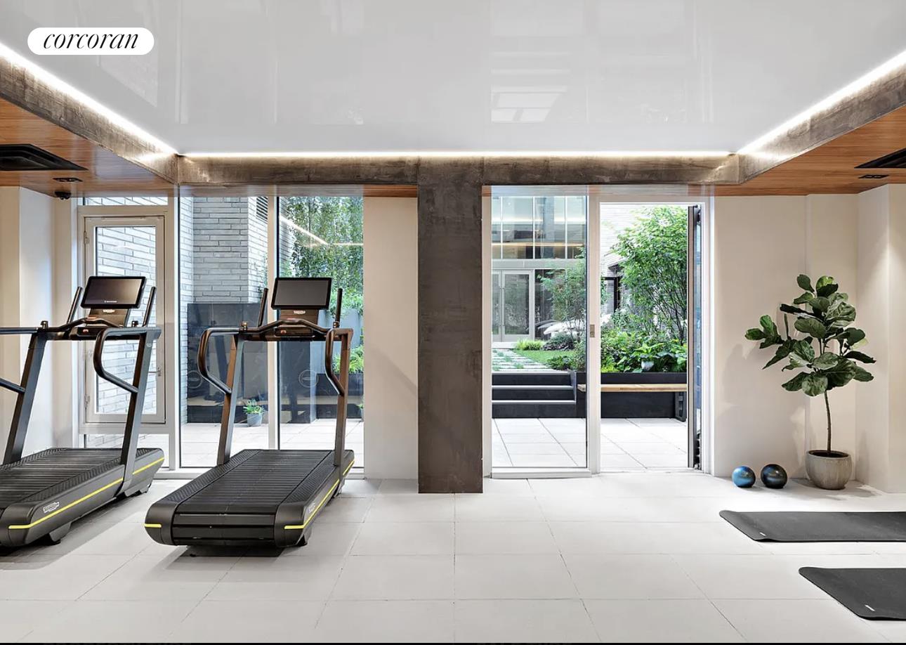 505-513 West 43rd Street, Unit 5J Manhattan, NY 10036 - Photo 11 of 17 a living room with furniture and a potted plant