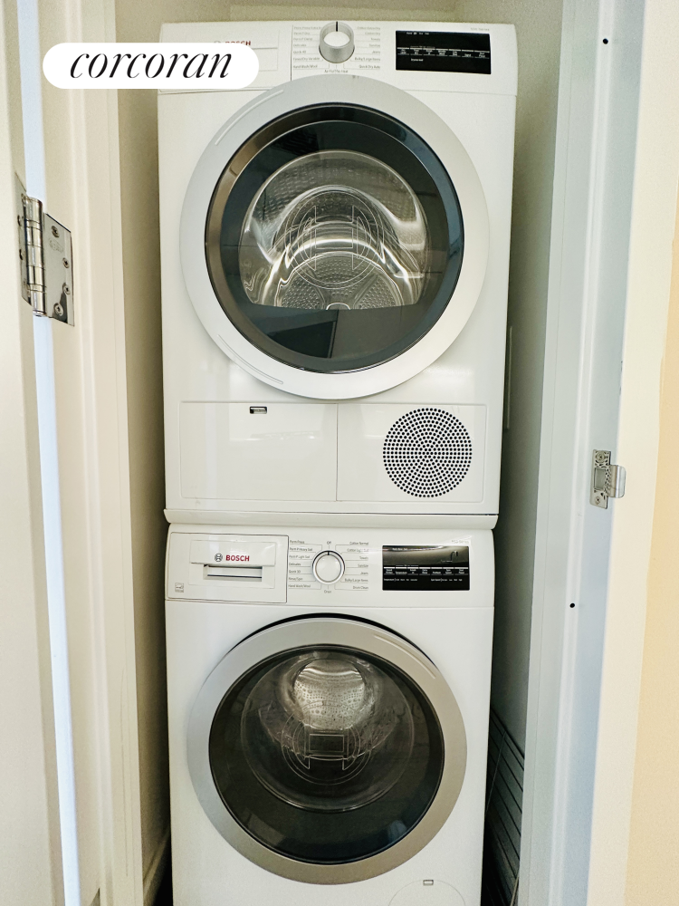 505-513 West 43rd Street, Unit 5J Manhattan, NY 10036 - Photo 7 of 17 a utility room with dryer and washer