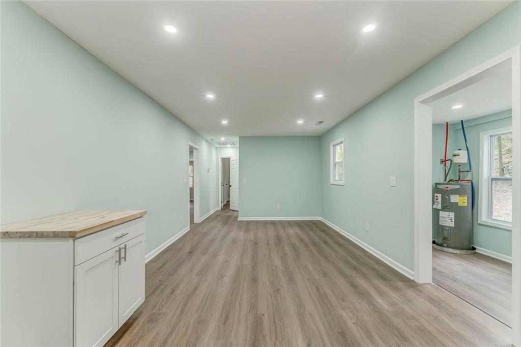 43 King Bee Circle Rome, GA 30161 - Photo 14 of 47 an empty room with wooden floor and windows