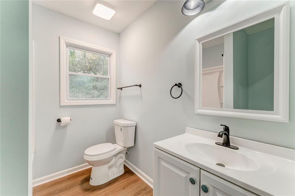 43 King Bee Circle Rome, GA 30161 - Photo 18 of 47 a bathroom with a toilet sink and mirror
