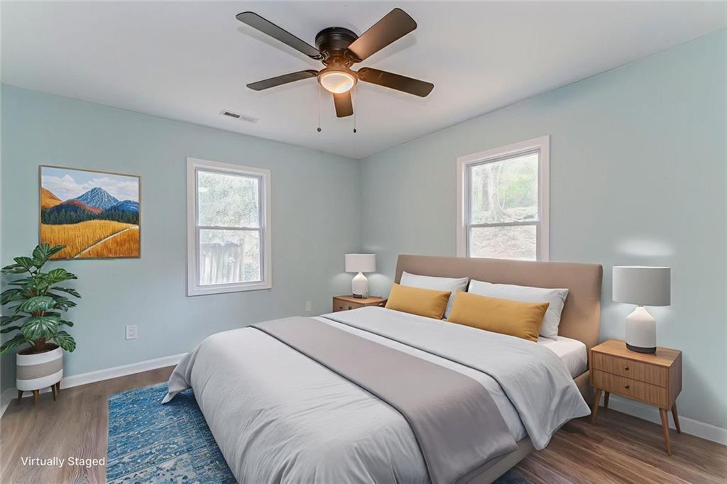 43 King Bee Circle Rome, GA 30161 - Photo 20 of 47 a bedroom with a bed and a potted plant