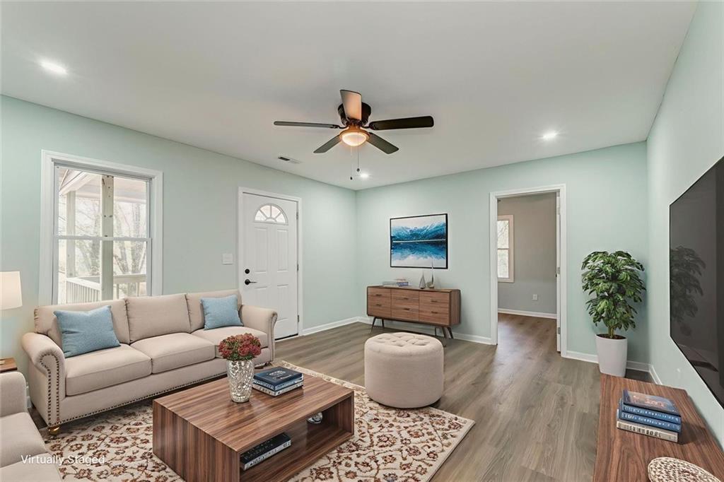 43 King Bee Circle Rome, GA 30161 - Photo 24 of 47 a living room with furniture a potted plant and a rug